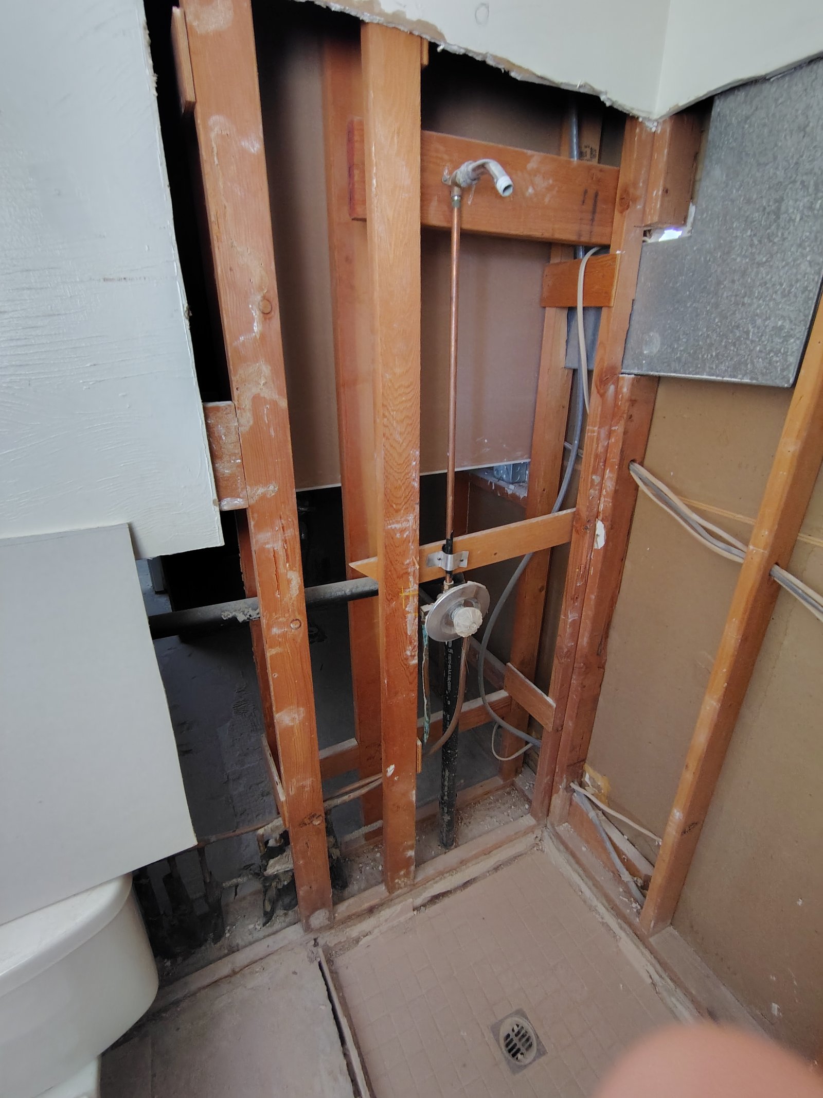 Bathroom shower demo framing and plumbing exposed Tucson AZ
