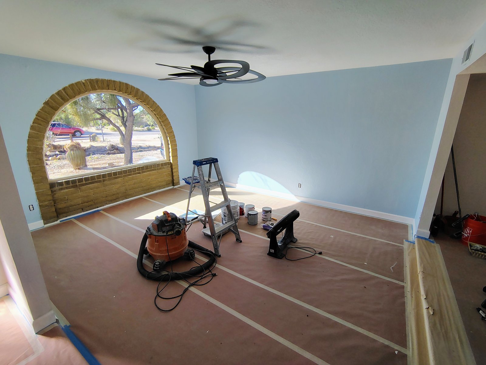 Interior room painting light blue arched window Tucson AZ