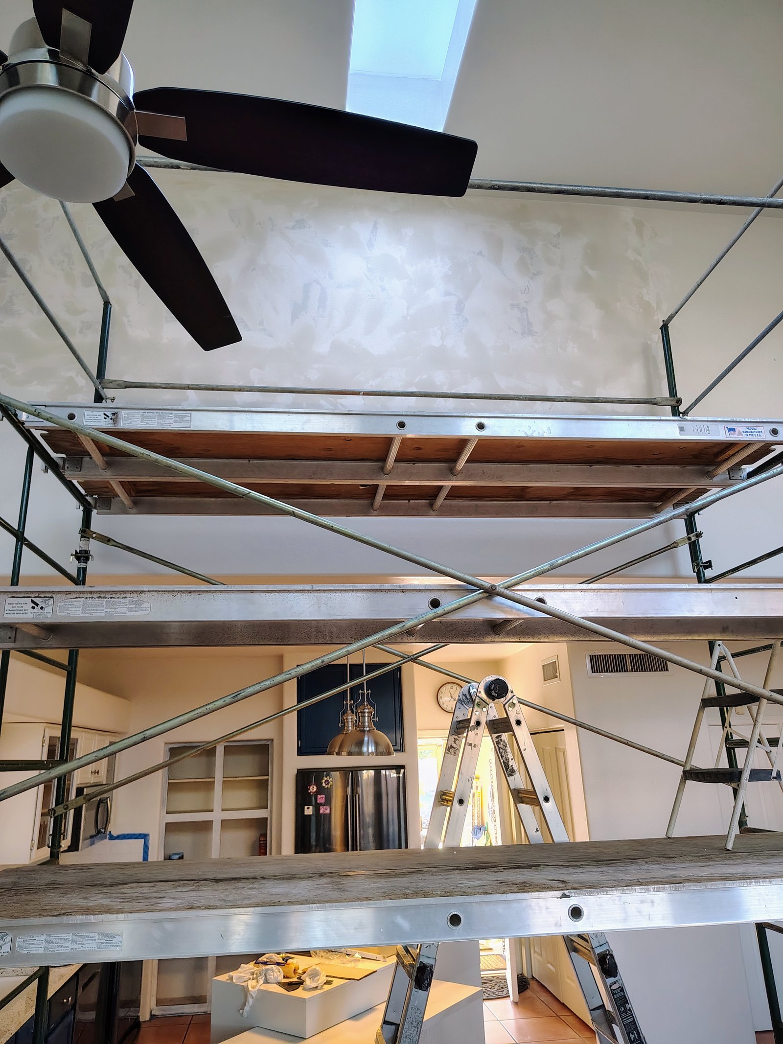 High wall drywall skim coat on scaffolding Tucson AZ